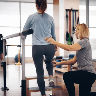 Guided Step-Up in Physical Therapy Gym