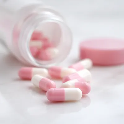 Pink and White Pharmacy Capsules Closeup
