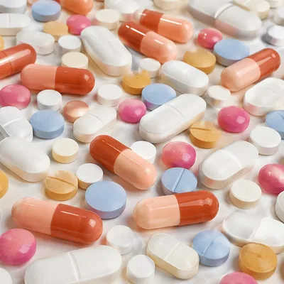 Assorted Pills on Clean Pharmacy Counter