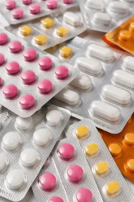 Colorful Medicine Blister Packs on Pharmacy Counter