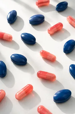 Assorted Blue Pills and Pink Capsules