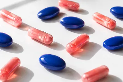 Assorted Medicine Pills on White Table