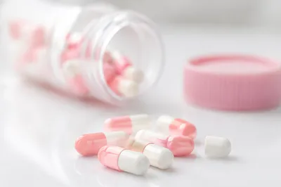 Pink and White Medicine Capsules Closeup