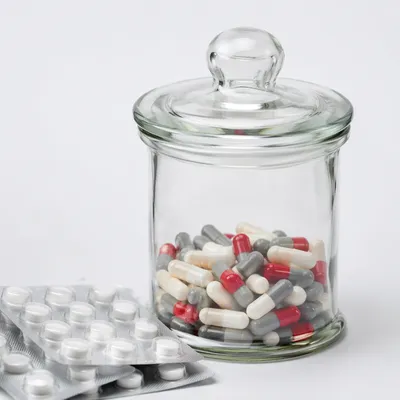 Generic Medicine Capsules in Pharmacy Jar