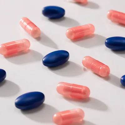 Assorted Medicine Pills on White Table