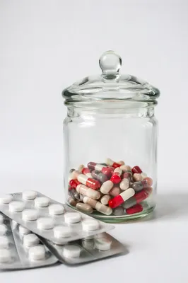 Pharmacy Capsules and Tablets in Glass Jar