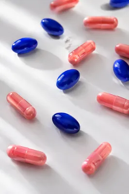 Assorted Medicine Pills on White Tabletop