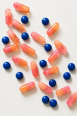 Assorted Capsules and Blue Tablets Overhead