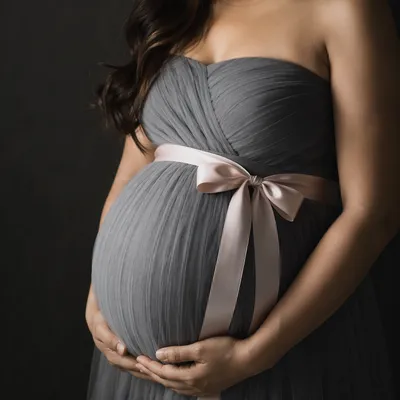Tender Maternity Belly With Blush Ribbon