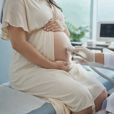 Prenatal Doppler Checkup With Maternity Belly