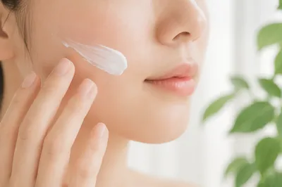 Close-Up Skincare Cream Application in Calm Studio