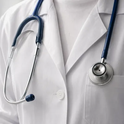 Close-Up Stethoscope on White Coat Pocket