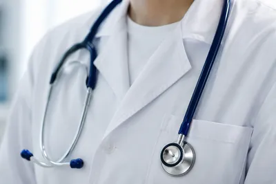 Close-Up Stethoscope on White Lab Coat