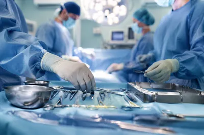 Surgical Team Preparing Instruments in Operating Room