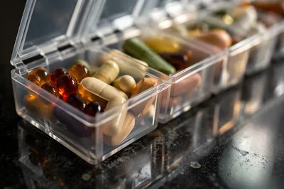 Weekly Pill Organizer with Vitamins Close-Up