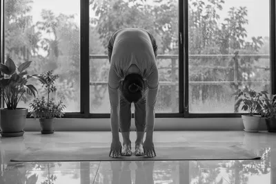 Peaceful Forward Fold on Yoga Mat