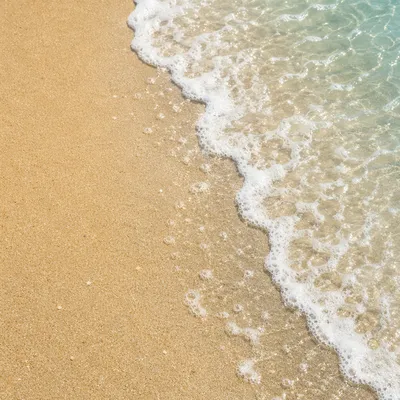 Tropical Shoreline Waves on Golden Sand