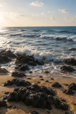 Summer Waves Over Volcanic Beach Rocks