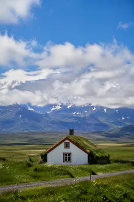 White Cottage in Expansive Green Meadow