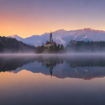 Calm Alpine Lake Reflection at Dawn