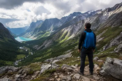 Lone Hiker Over Alpine Mountain Valley