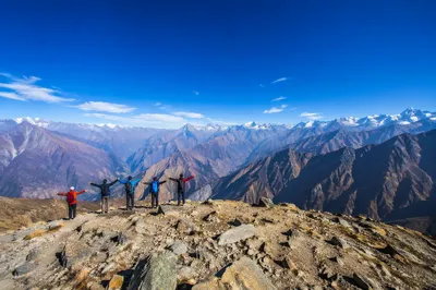 Hikers Celebrating on Alpine Mountain Ridge