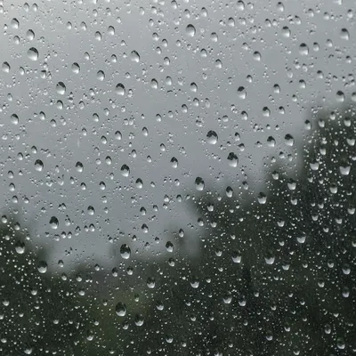 Rain Droplets on Blurred Window Glass
