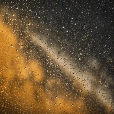 Rain Drops on Stormy Window Glass