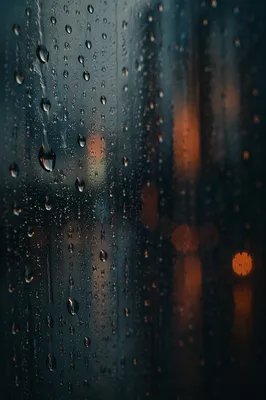 Rain Droplets on Window at Dusk
