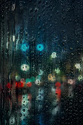 Rain Droplets on Blurred Night Window