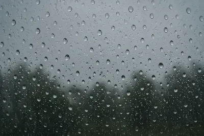 Rain Droplets on Blurred Window Glass