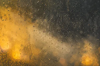 Rain Droplets on Blurred Storm Window