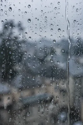 Rain Droplets on Blurred Window Glass