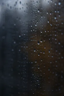 Rain Droplets on Stormy Window Glass
