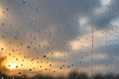 Raindrops on Window at Golden Hour