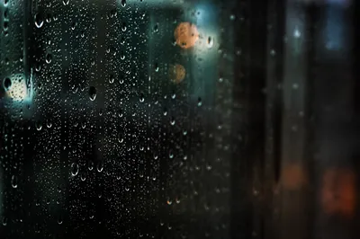 Rain Droplets on Window at Dusk