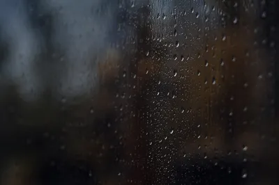 Rain Droplets on Blurred Storm Window