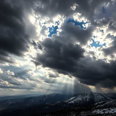 Dramatic Storm Clouds Over Mountain Ridges