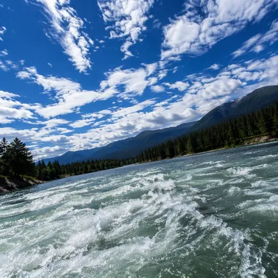 Dramatic Blue Sky Over Rushing Waters