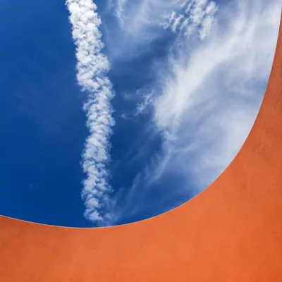 Dramatic Blue Sky with Terracotta Curve