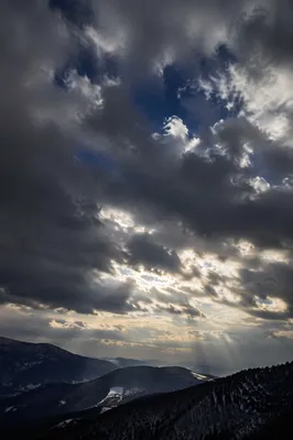 Dramatic Storm Clouds Over Mountain Ridges