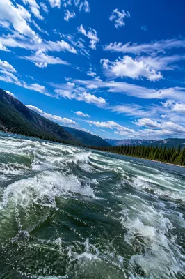Dramatic Blue Sky Over Churning River
