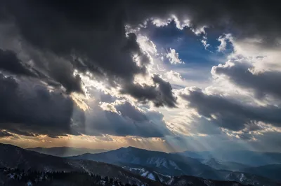 Dramatic Storm Clouds Over Mountain Ridges