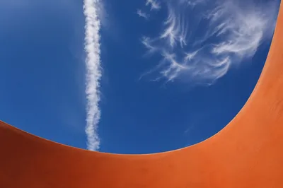 Dramatic Blue Sky with Terracotta Curve