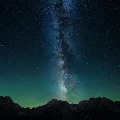 Milky Way Over Dark Mountain Silhouettes