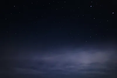 Serene Starry Night Sky Above Mist