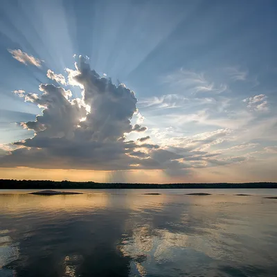 Sun Rays Breaking Through Lakeside Clouds