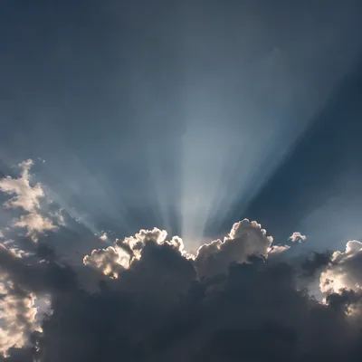 Dramatic Sun Rays Through Storm Clouds