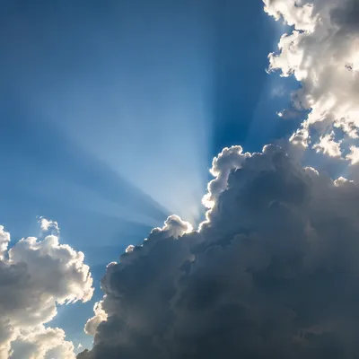 Sun Rays Breaking Through Cumulus Clouds
