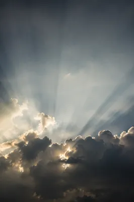 Dramatic Sun Rays Through Storm Clouds